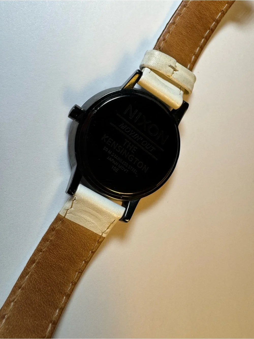 Nixon “Movin’ Out” Kensington analog watch with white leather band